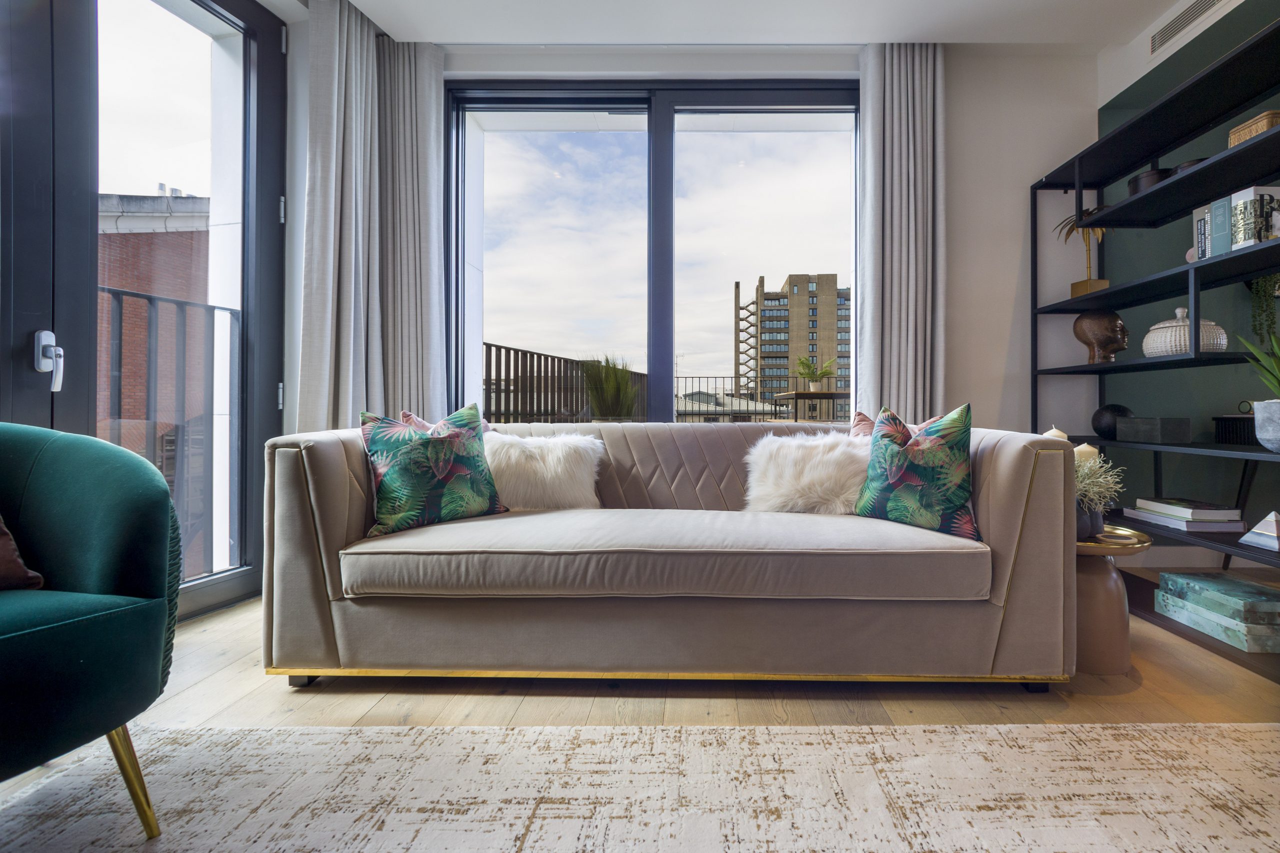 The Denizen lounge - Sofa facing against large windows, facing the camera