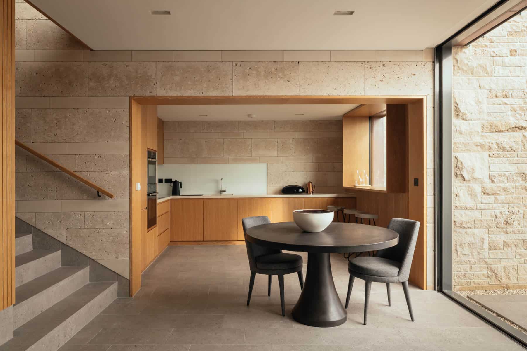 Minimalist interior of kitchen and dining area in lodge at The Clifftops